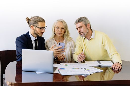 older couple talking with an inheritance funding expert
